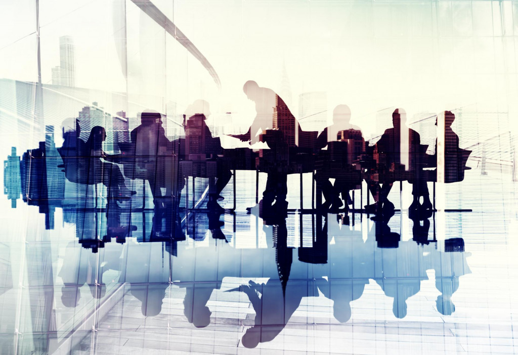 Abstract Image of Business People&amp;#39;s Silhouettes in a Meeting
