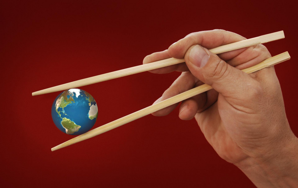 &lt;p&gt;hand holding the earth between two chopsticks on Chinese red background&lt;/p&gt;
