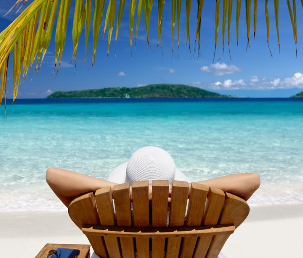 &lt;p&gt;woman sunbathing in a teak chair on a beautiful Caribbean beach&lt;/p&gt;
