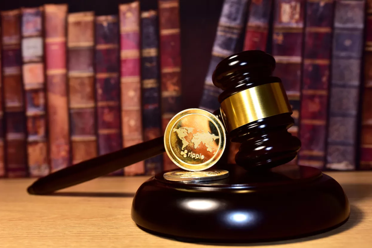 Judge hammer and XRP crypto coin. Justice courtroom. Ripple demands Bitcoin and Ethereum docs from SEC amid legal fight. Delist �ryptocurrency trading. Exchanges and traders. law to ban blockchain<br>ripple SEC