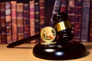 Judge hammer and XRP crypto coin. Justice courtroom. Ripple demands Bitcoin and Ethereum docs from SEC amid legal fight. Delist Ñ�ryptocurrency trading. Exchanges and traders. law to ban blockchain<br>ripple SEC