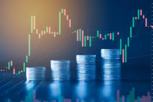 Stack of money coin with trading graph, financial investment concept with blue filter can be use as backgrounddionički kapital, dokapitalizacija, burza, cijene na burzi, cijene dionica, cijena dionica