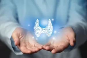 Thyroid gland issues medical concept. Photo of female doctor, empty space.