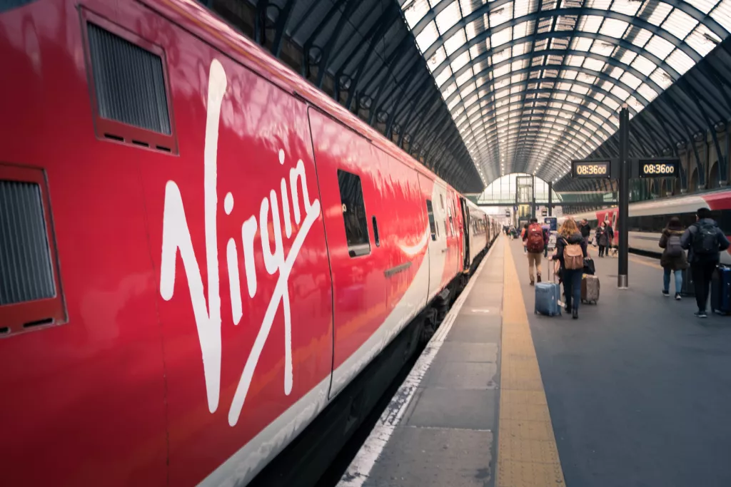 London, United Kingdom - April 2018 Passengers walk on platform of London King's Cross station where is a Central London railway terminus on the northern edge of the city