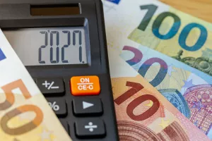 Euro currency in 2027 year. Financial business concept. Money and calculator with date 2027. Market analysis Eurozone. exchange rate. Economic background. closeup
