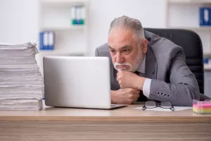 Old male employee and too much work in the office